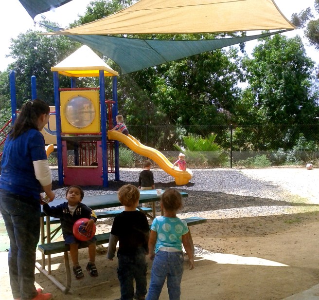 watching her through the classroom window.